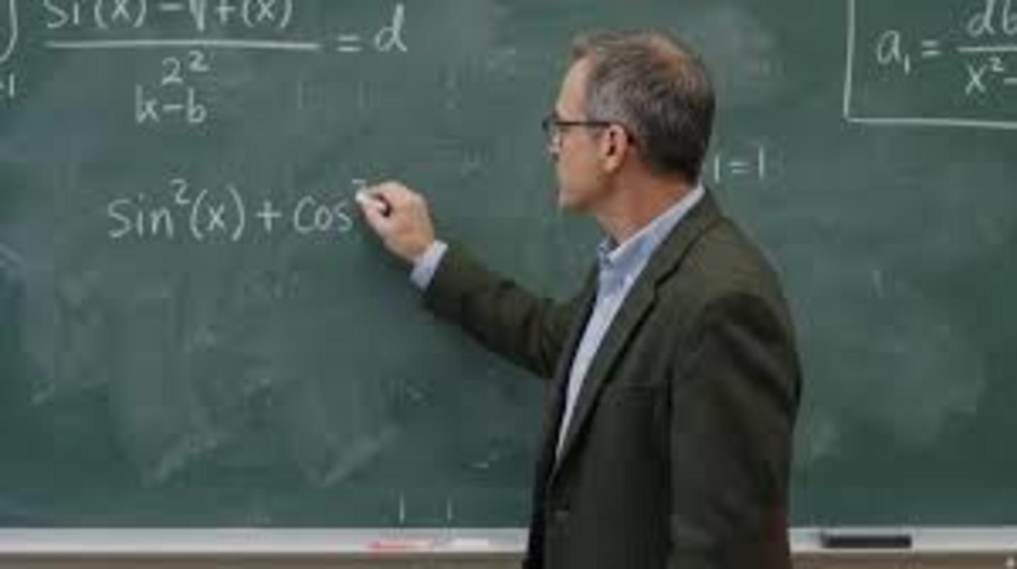 Professor writing math on blackboard